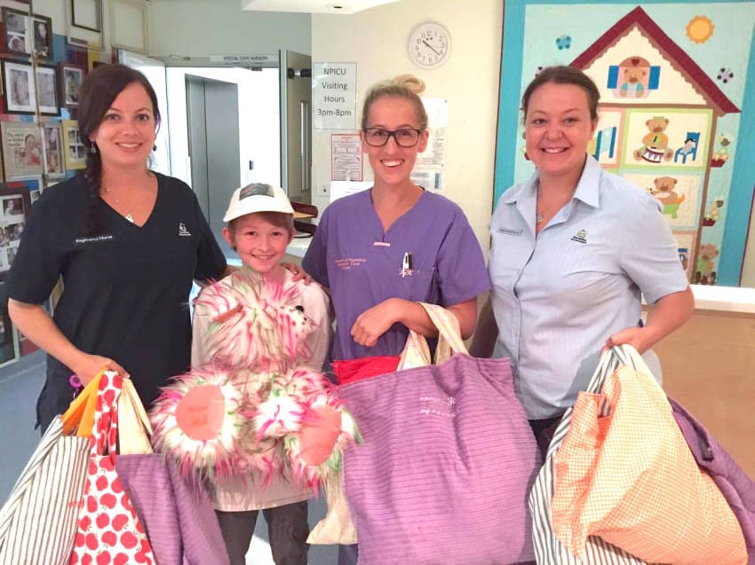 Campbell Remess Giving Teddy Bears to Hospital