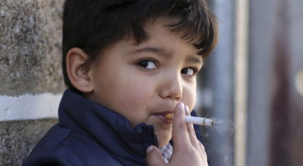 Portugal celebrates Epiphany with children 5 years old smoking cigarettes