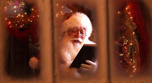 Eric Schmitt-Matzen reading book as Santa Claus