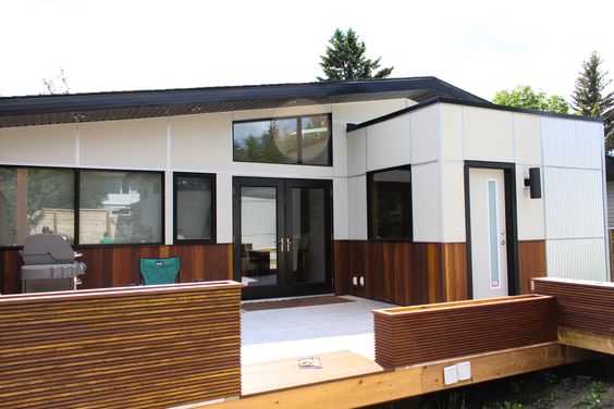 Two-Tone Façade with Wood Skirting - Exterior House Siding Ideas