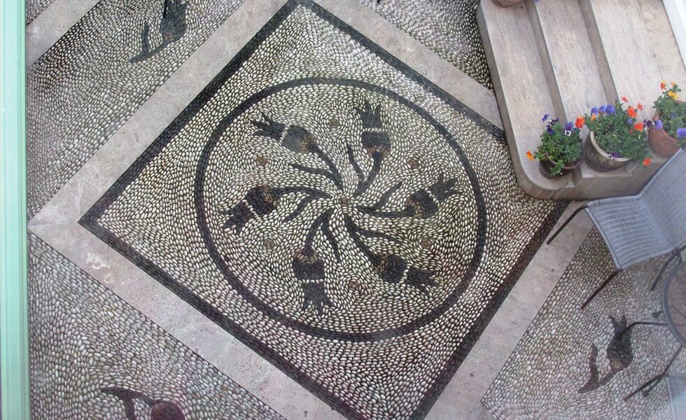 Pebble Mosaic Details Near Entryways - Landscaping Rock Ideas
