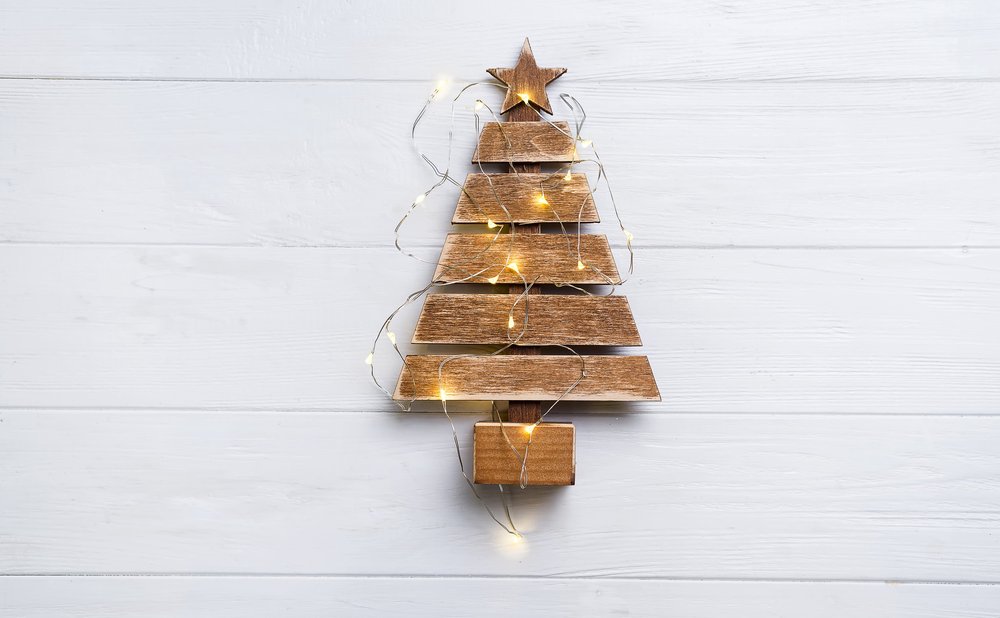Scrap wood Christmas tree made of stacked boards on a tabletop