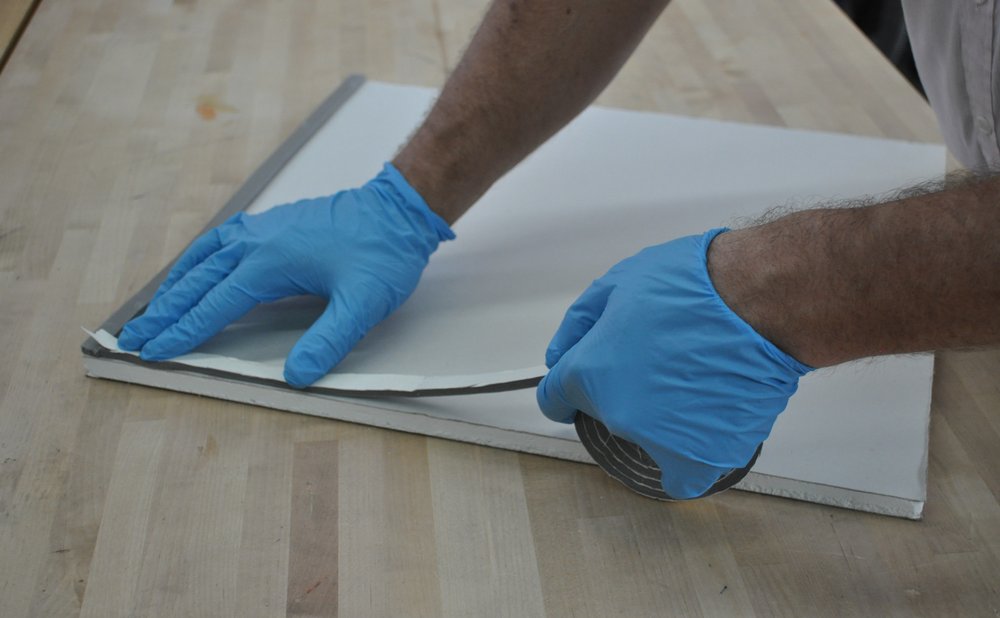 New foam weatherstripping for front doors pressed into the jamb groove