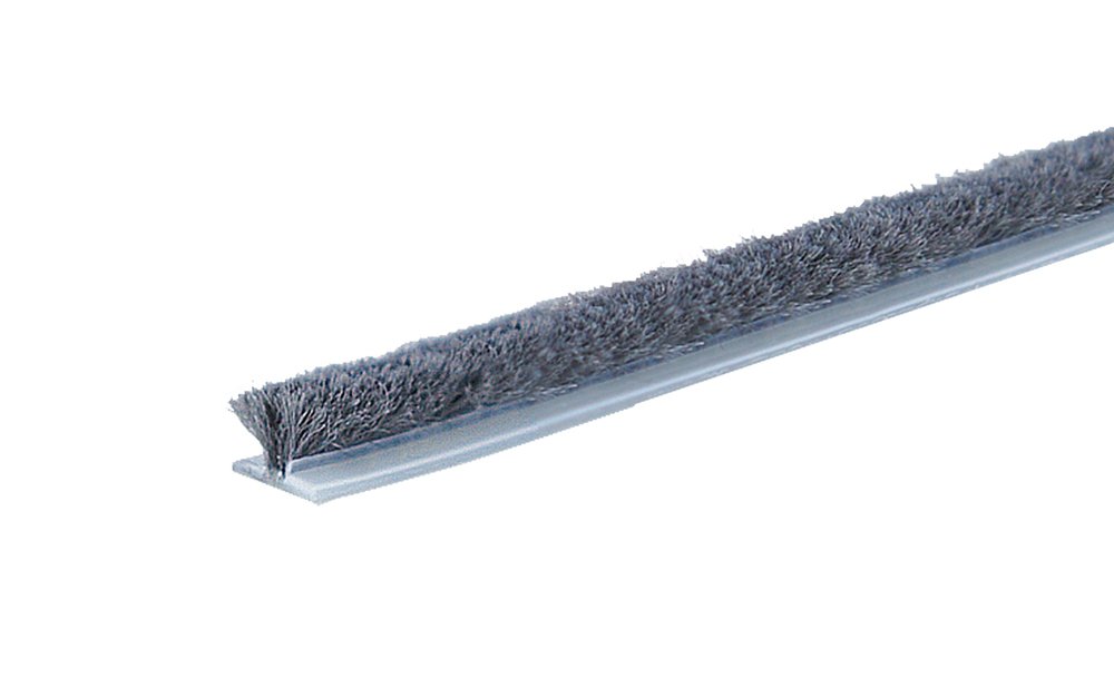 Worn pile weatherstripping on a sliding glass door frame that lets in drafts