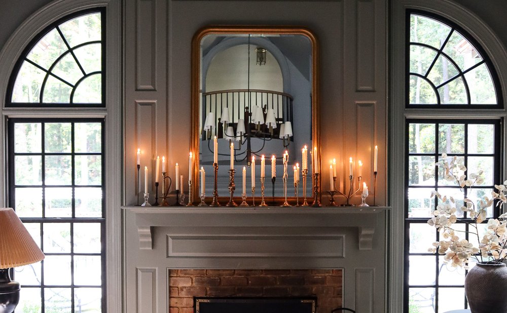 Fall mantel with brass candlesticks holding tall taper candles