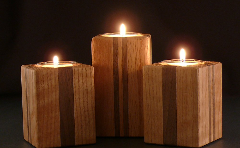 Wooden candle holders made from scrap wood blocks with tea lights