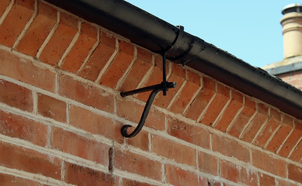Gutter hanger bracket to check along with the pitch and seams for leaks