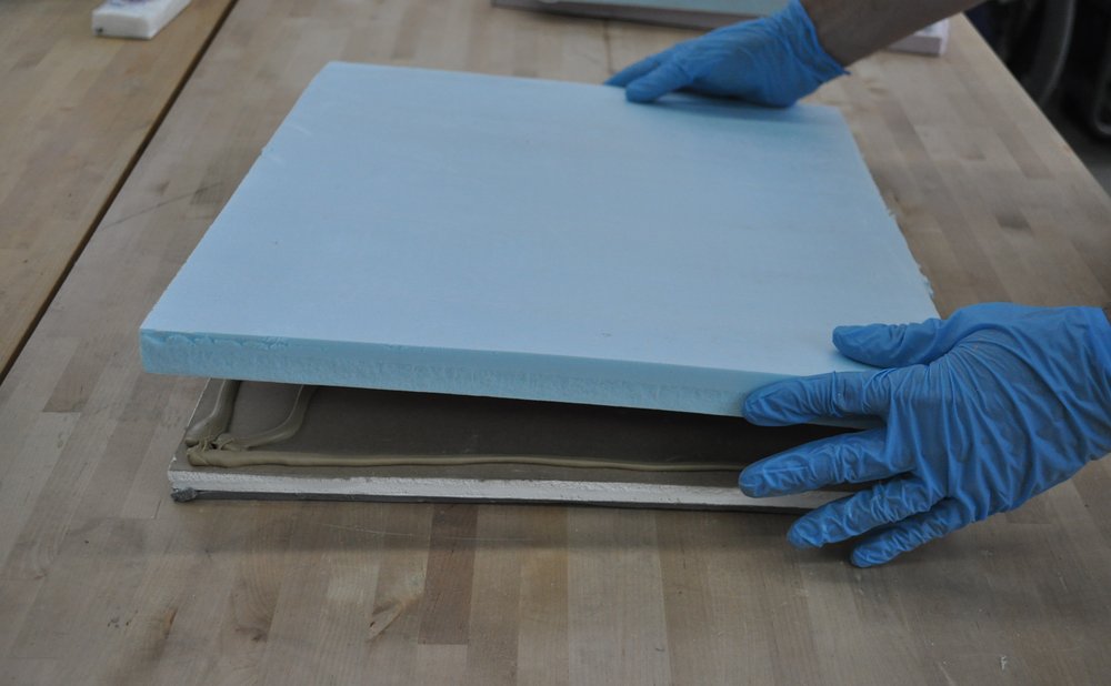 Foam weatherstrip and rigid insulation on an attic hatch to stop drafts