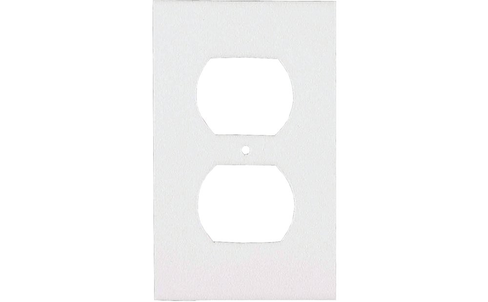Foam gasket placed behind an outlet cover on an exterior wall to stop drafts
