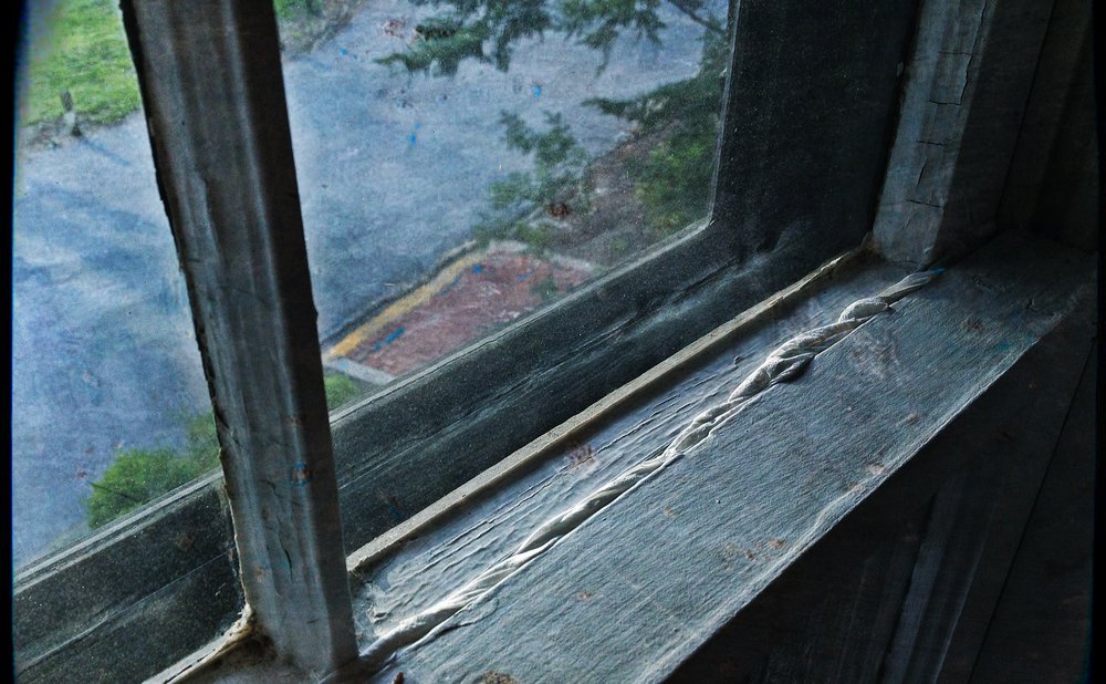 Clear window insulation film on a drafty window for the winter season