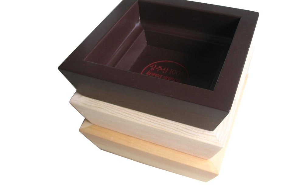 Wooden serving tray with handles holding coffee mugs