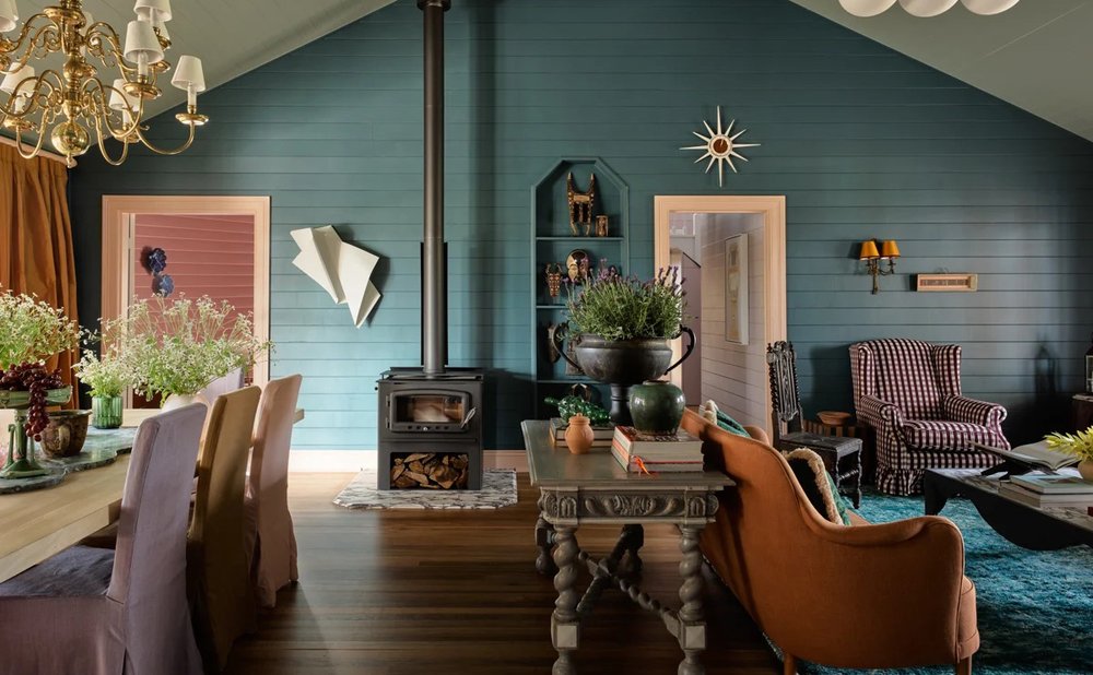 Teal-painted shiplap walls in a farmhouse living room